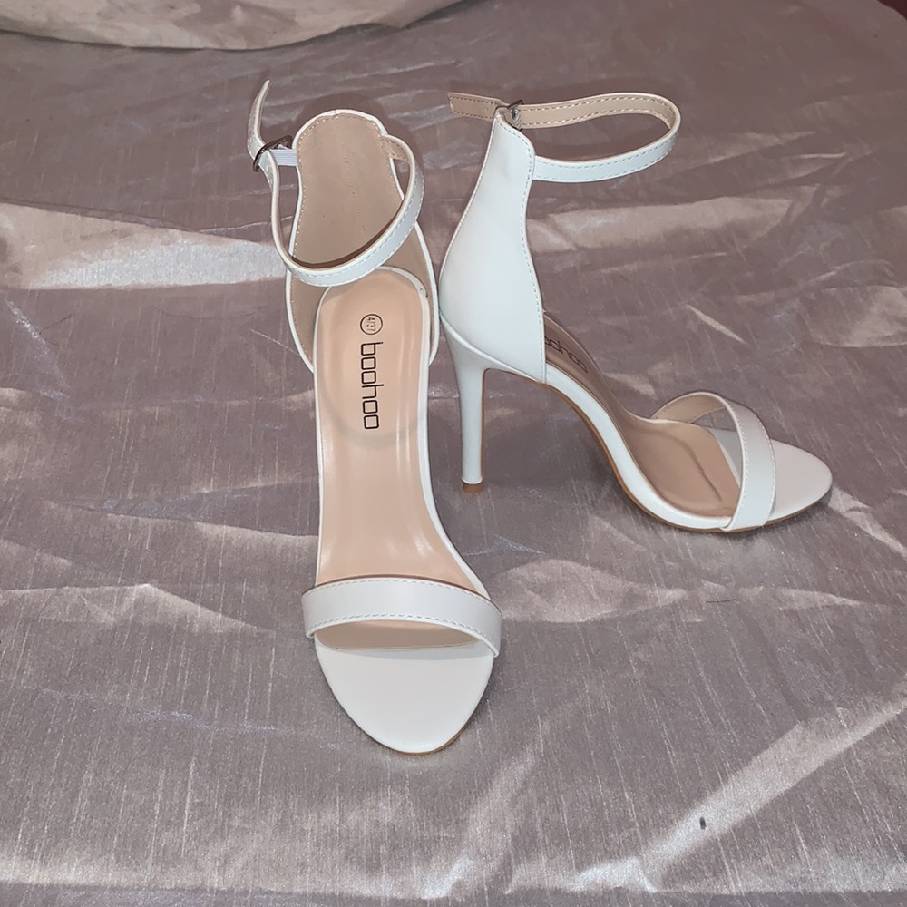 White thin strap sandal heels.